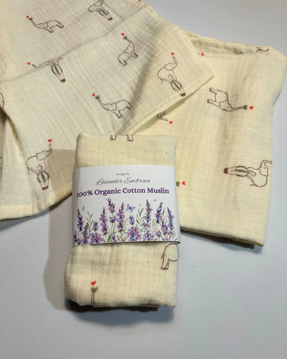 Folded organic cotton muslin fabric with a label on a gray background